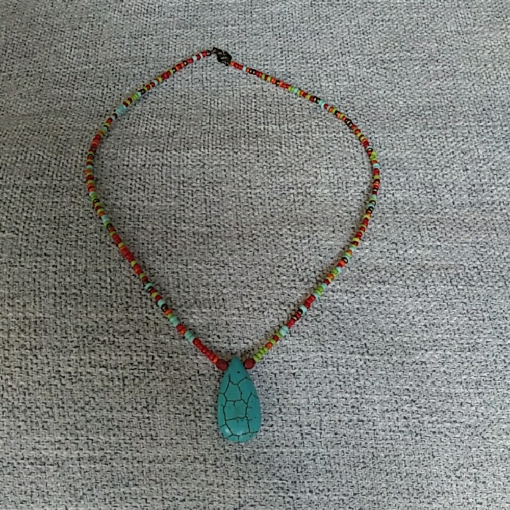 Colorful necklace with blue teardrop pendant